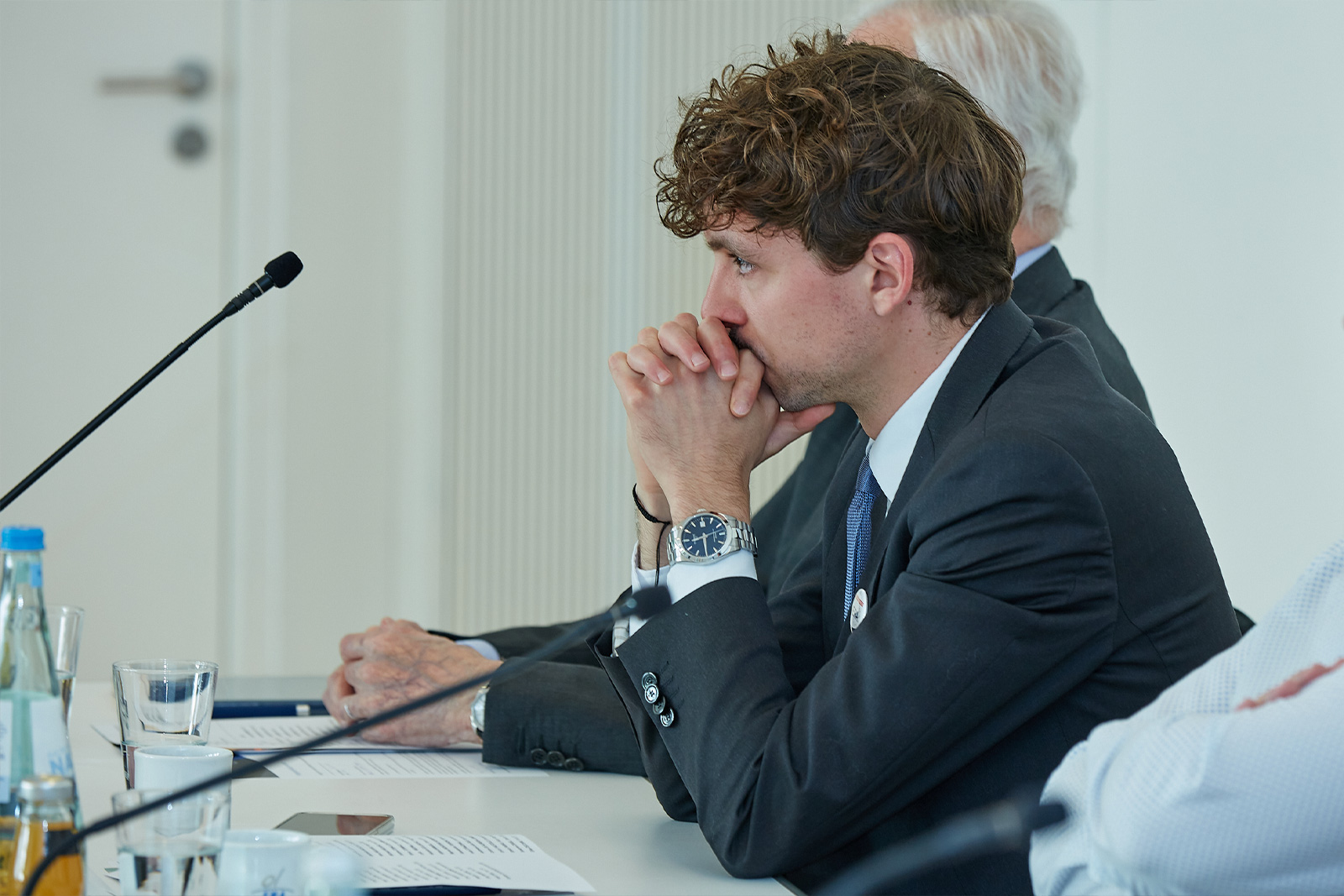 Friends of ERA members sitting at a conference table during a meeting, symbolizing dialogue, collaboration, and engagement in European law.