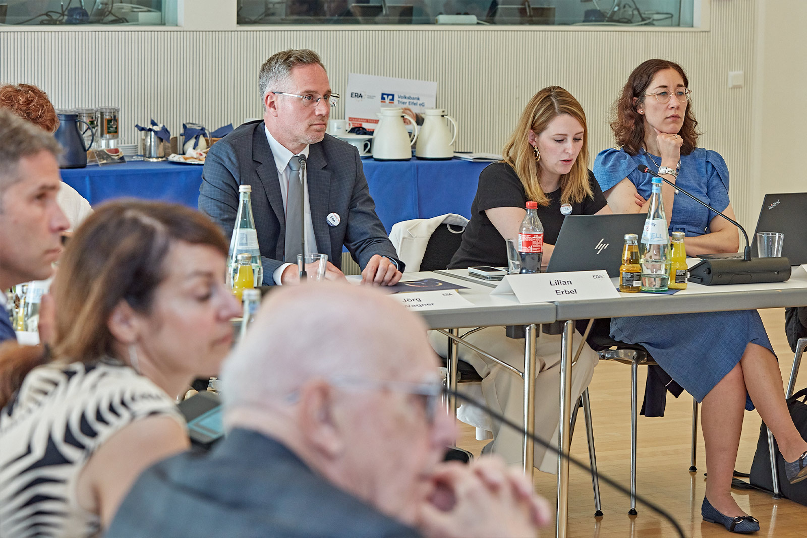 Friends of ERA members sitting at a conference table during a meeting, symbolizing dialogue, collaboration, and engagement in European law.