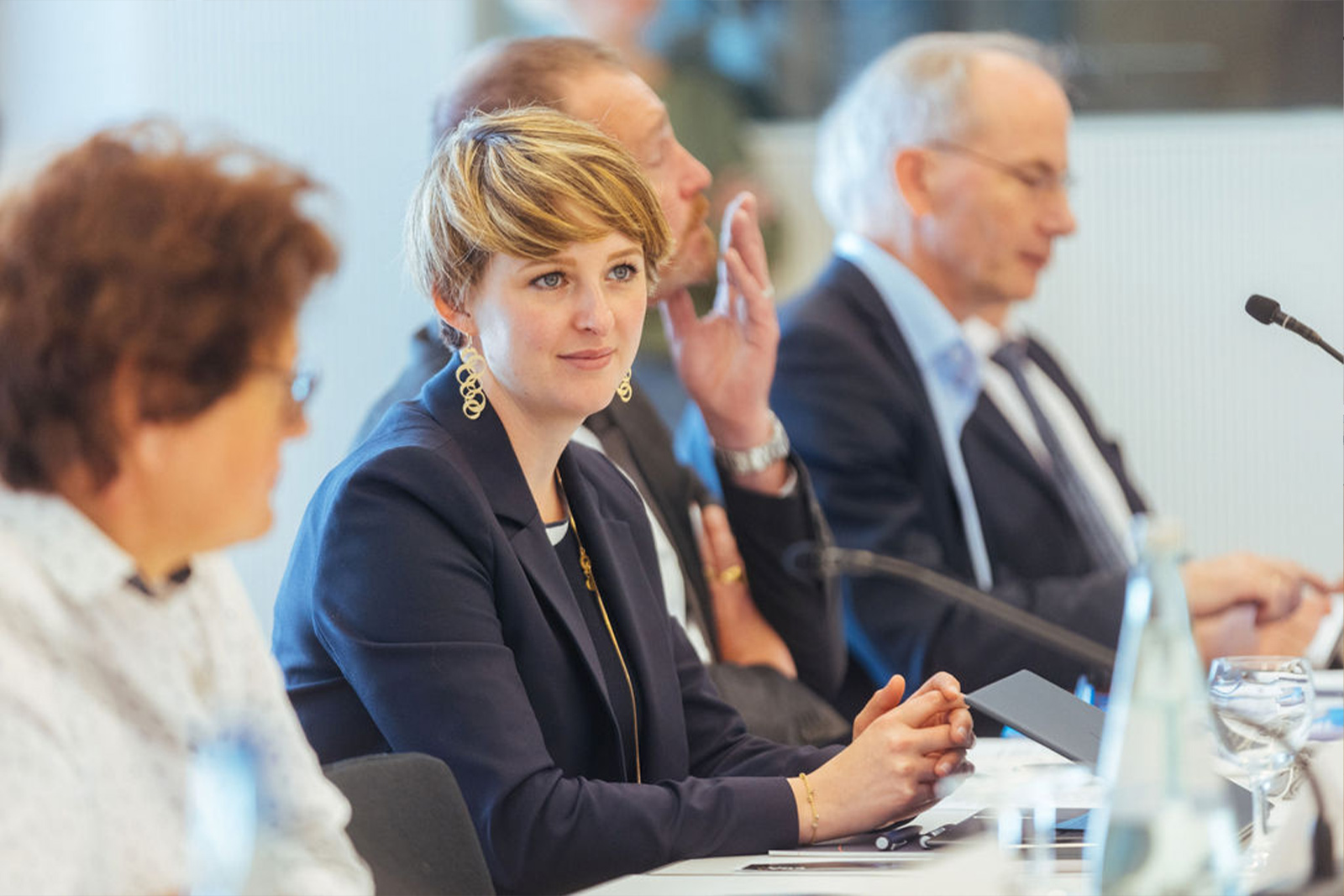 Friends of ERA members sitting at a conference table during a meeting, symbolizing dialogue, collaboration, and engagement in European law.